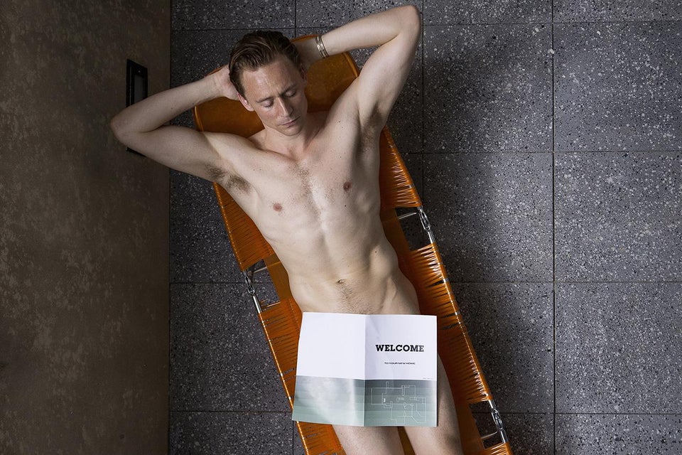 Naked (covered) picture of Tom Hiddleston. 