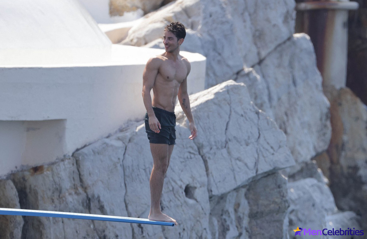 Manu Rios half-naked on the beach in Cannes