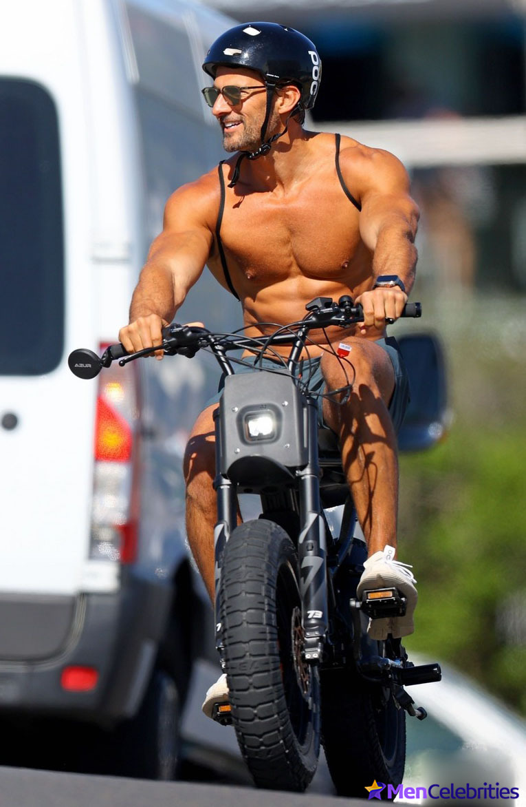Tim Robards shows off his muscular torso on the beach