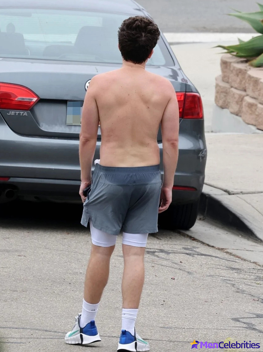 Charlie Puth shows off his naked torso while running