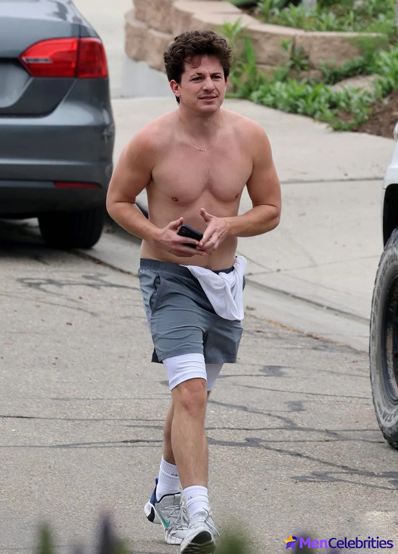 Charlie Puth shows off his naked torso while running