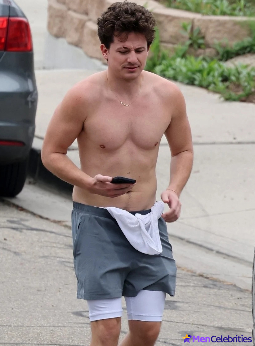 Charlie Puth shows off his naked torso while running