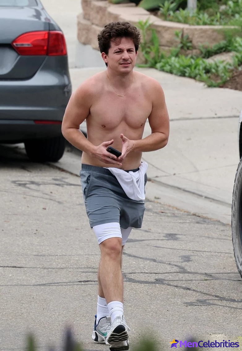 Charlie Puth shows off his naked torso while running