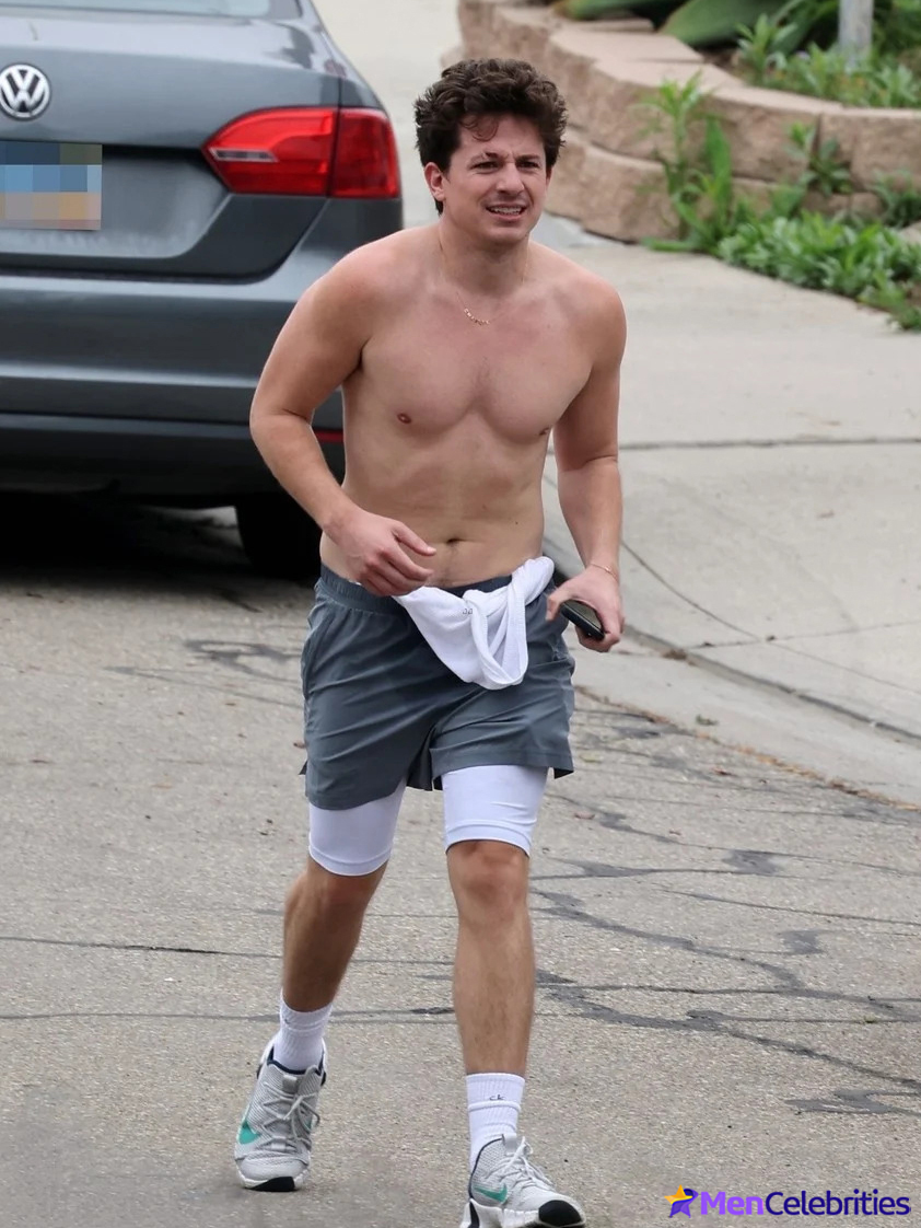 Charlie Puth shows off his naked torso while running