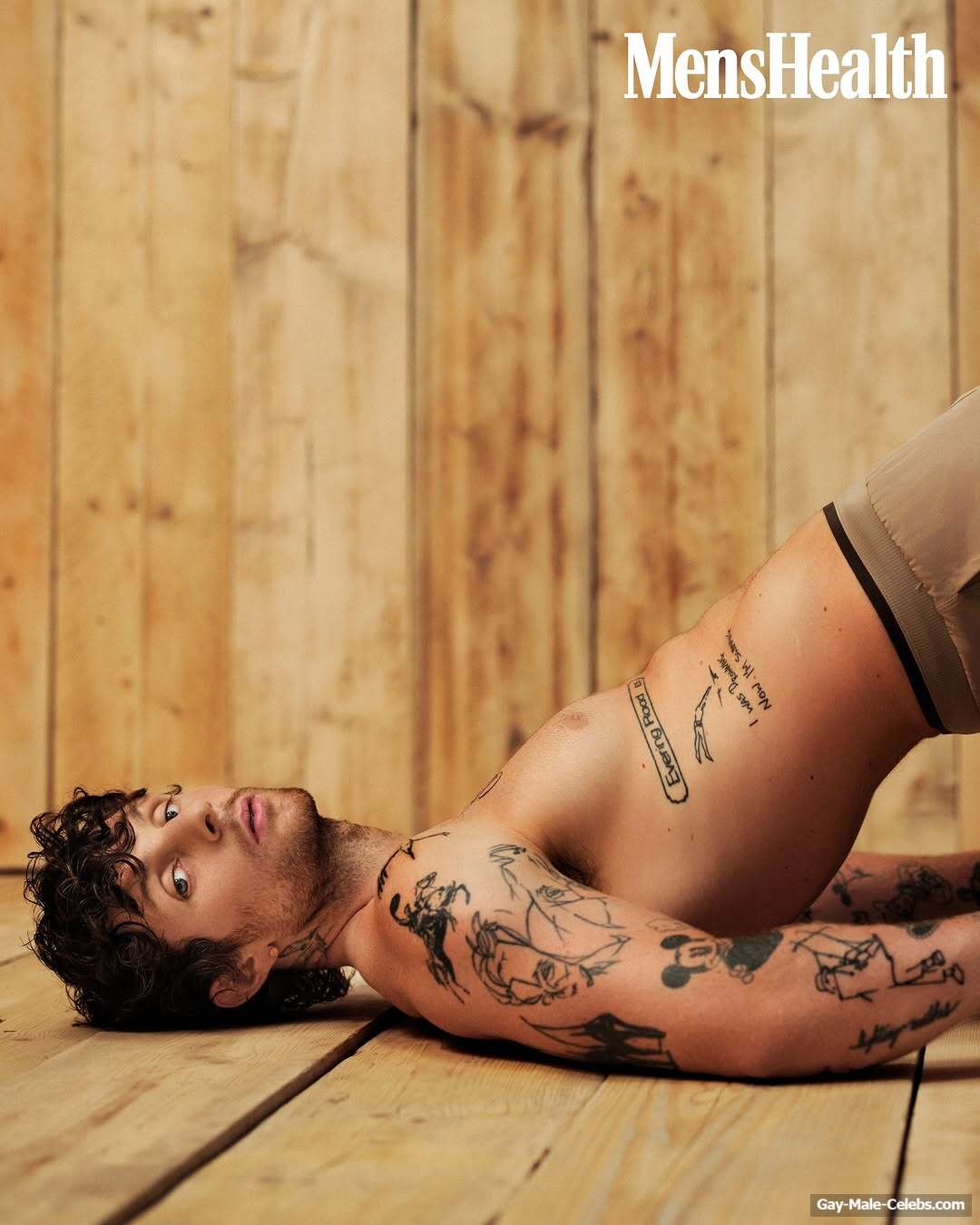 Tom Grennan posing shirtless