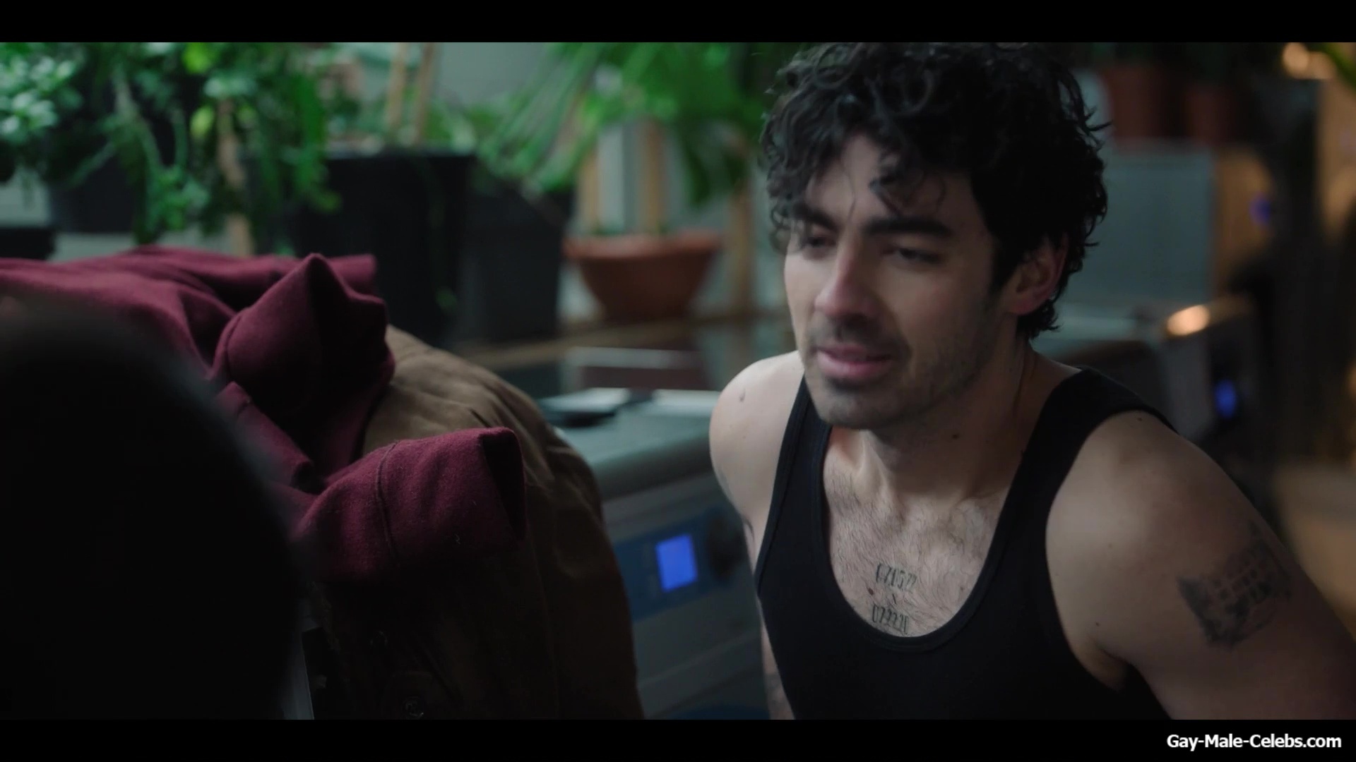 Joe Jonas shirtless in A Very Jonas Christmas Movie
