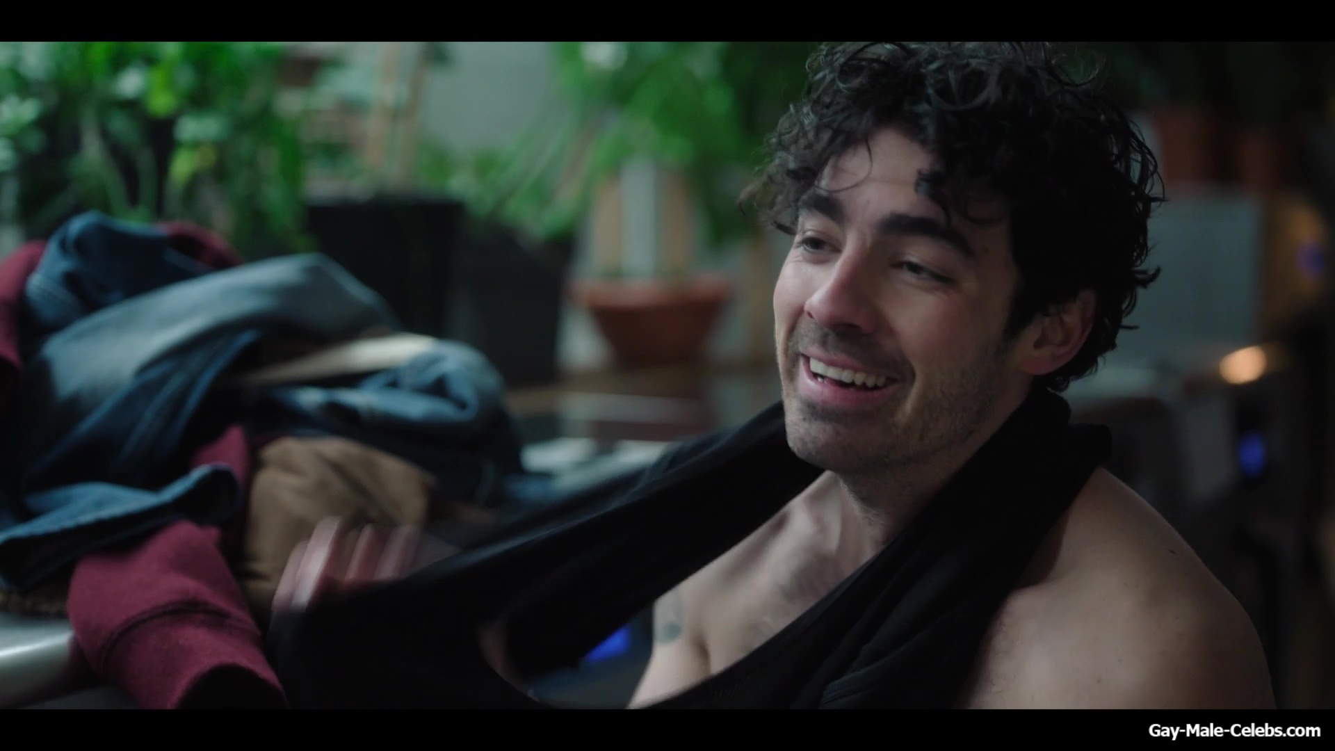 Joe Jonas shirtless in A Very Jonas Christmas Movie