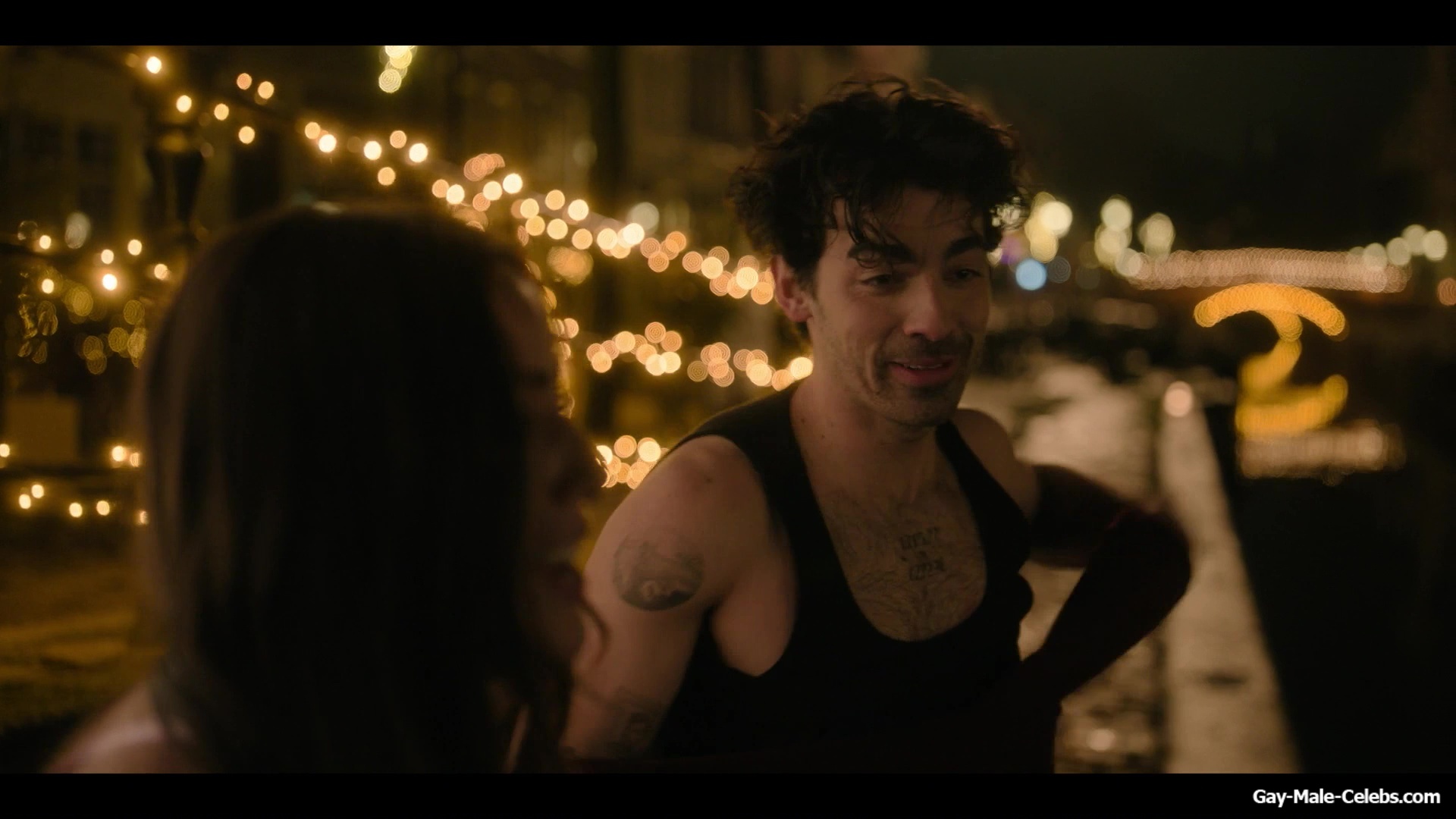 Joe Jonas shirtless in A Very Jonas Christmas Movie