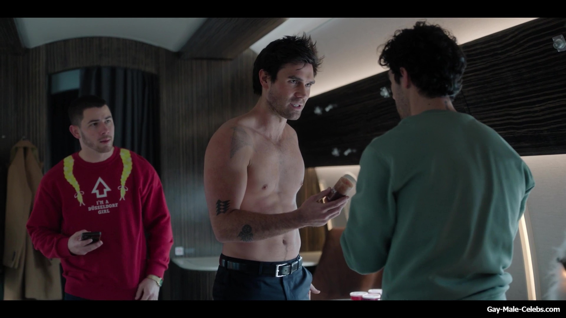 KJ Apa shirtless in A Very Jonas Christmas Movie