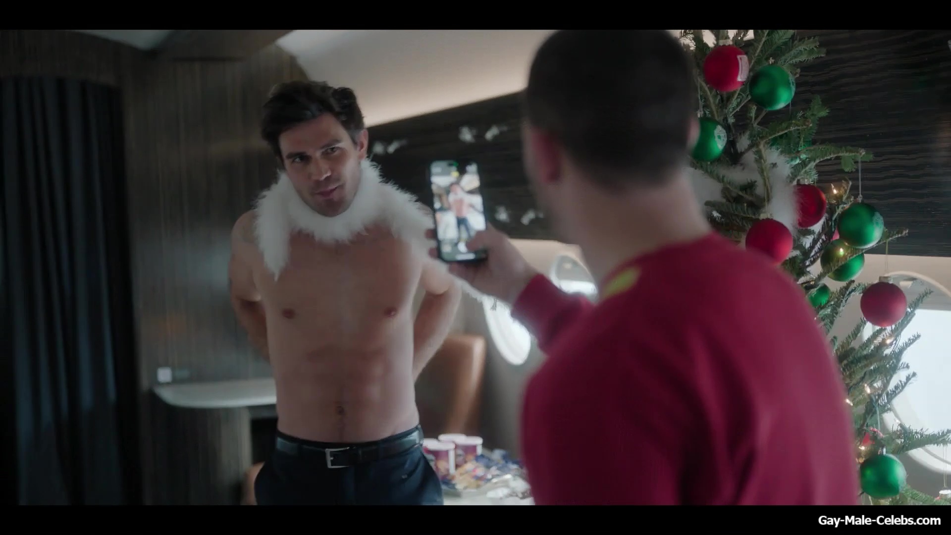 KJ Apa shirtless in A Very Jonas Christmas Movie