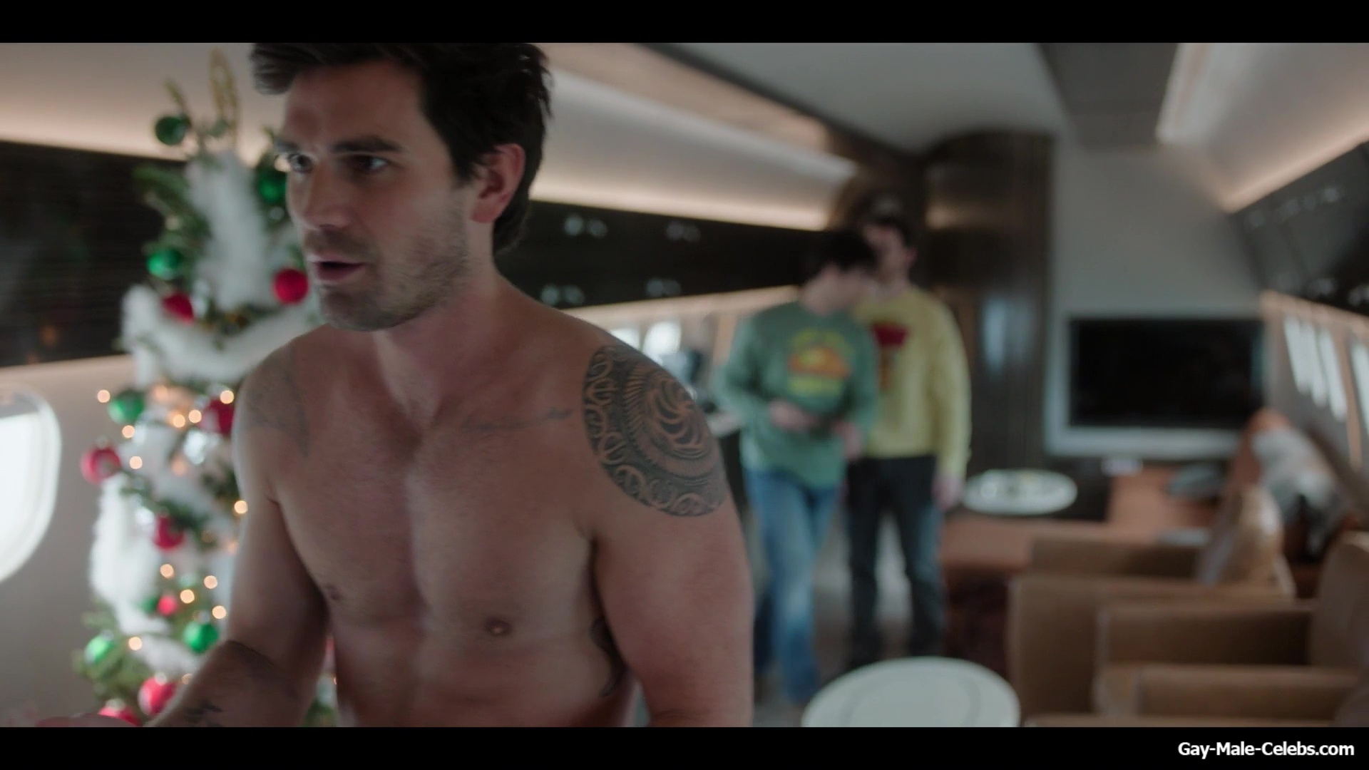 KJ Apa shirtless in A Very Jonas Christmas Movie