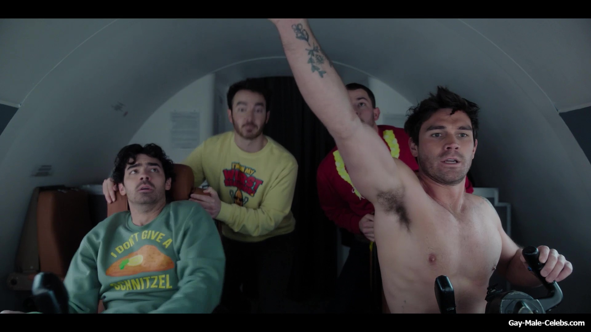 KJ Apa shirtless in A Very Jonas Christmas Movie