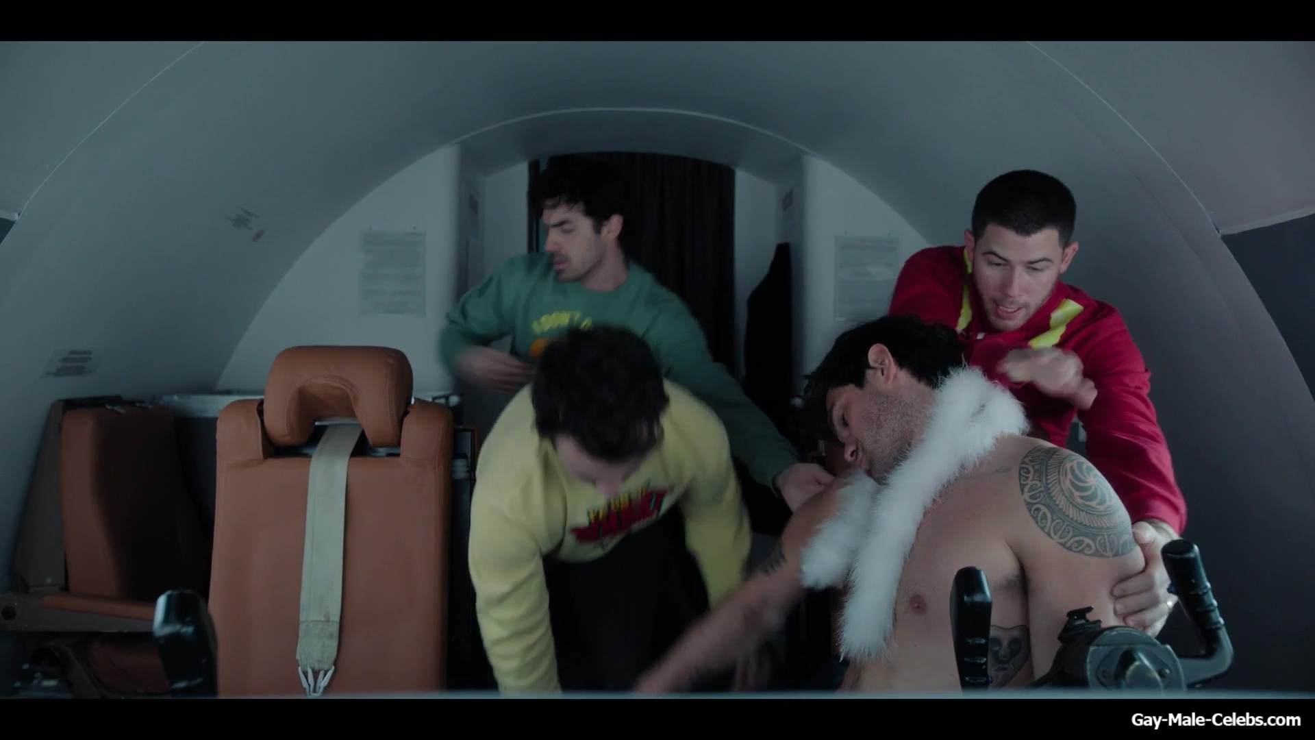 KJ Apa shirtless in A Very Jonas Christmas Movie