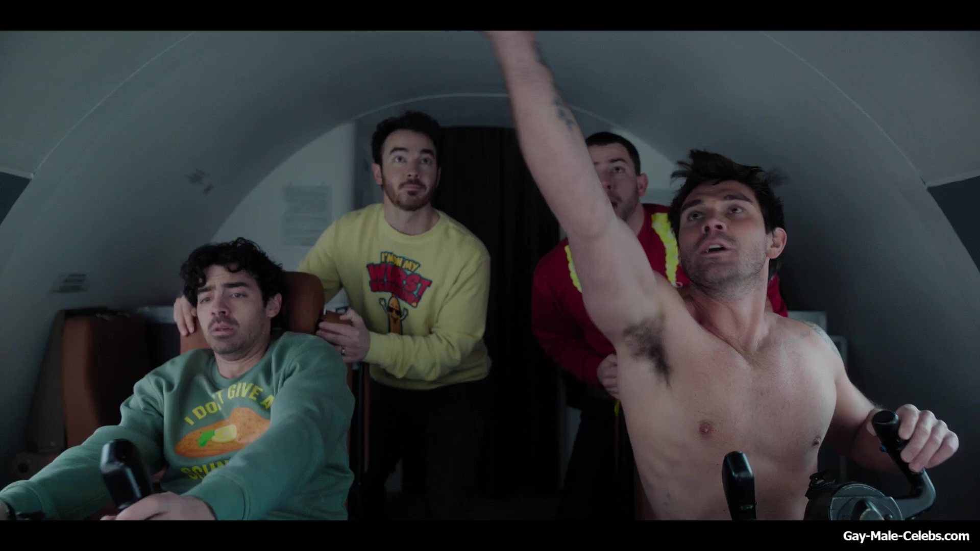 KJ Apa shirtless in A Very Jonas Christmas Movie