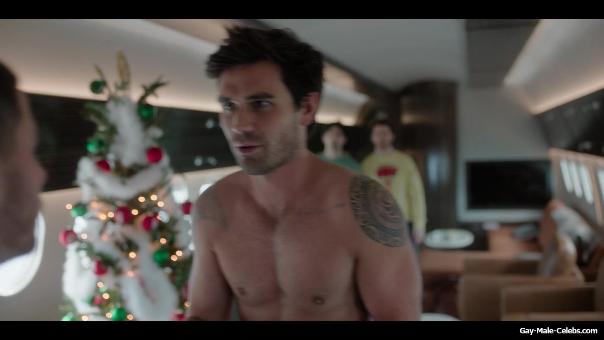 KJ Apa shirtless in A Very Jonas Christmas Movie