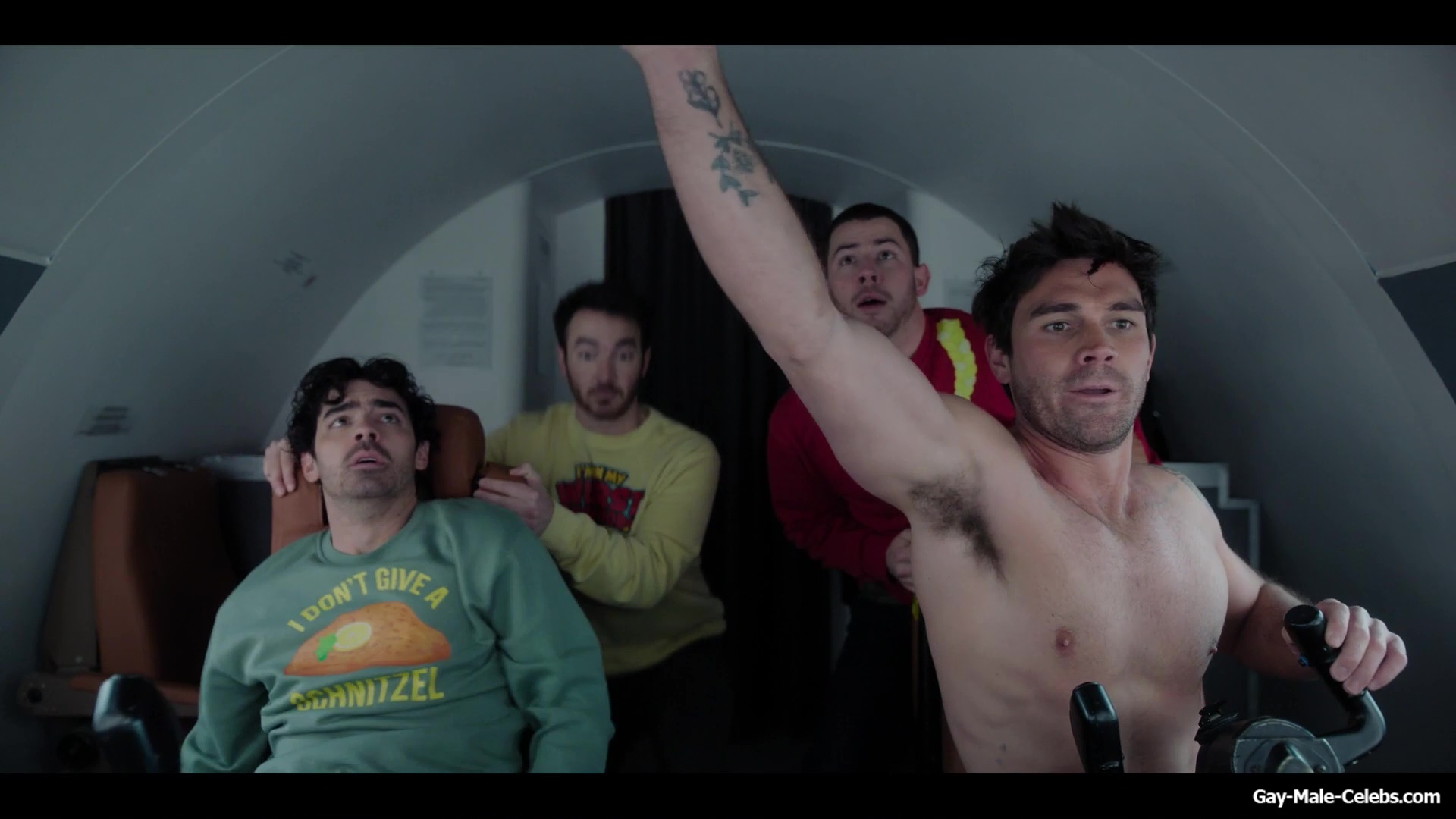 KJ Apa shirtless in A Very Jonas Christmas Movie