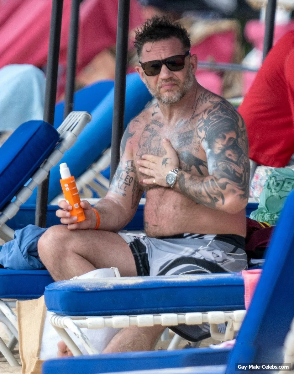 Tom Hardy shirtless on a beach