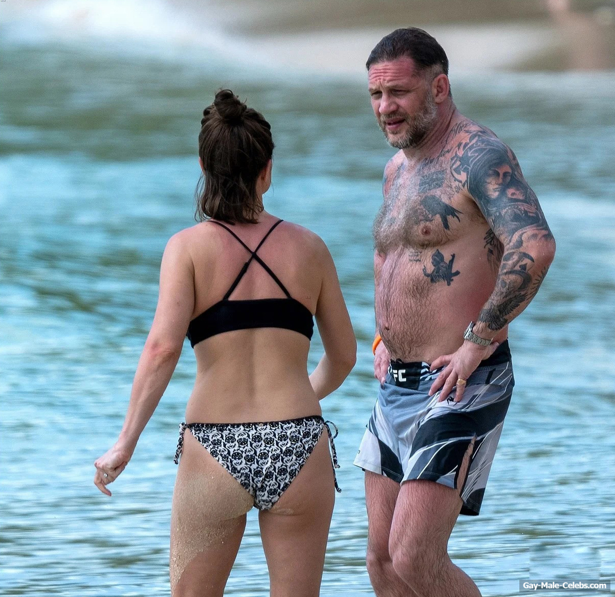 Tom Hardy shirtless on a beach