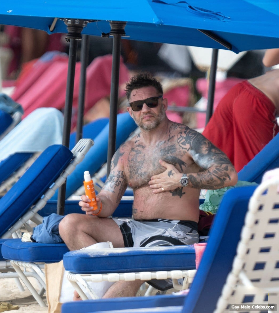 Tom Hardy shirtless on a beach