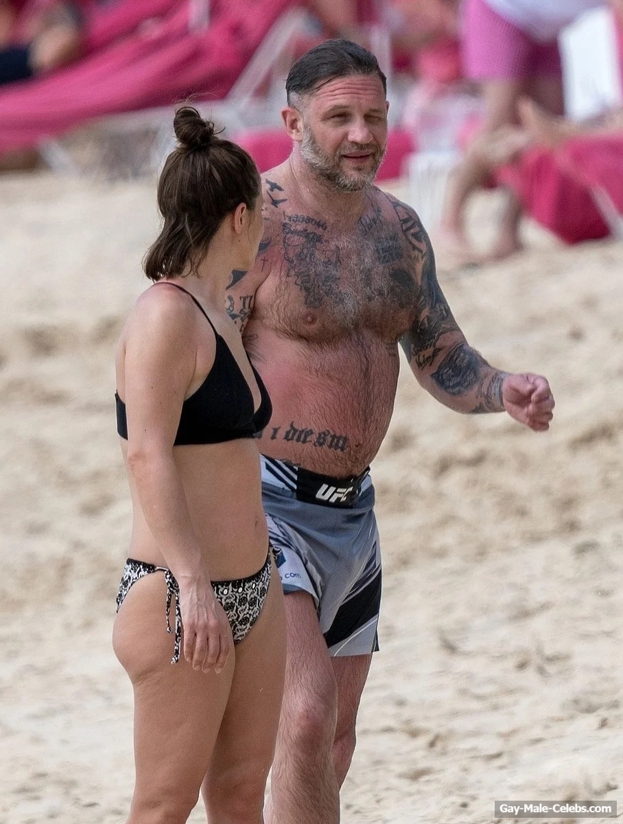 Tom Hardy shirtless on a beach