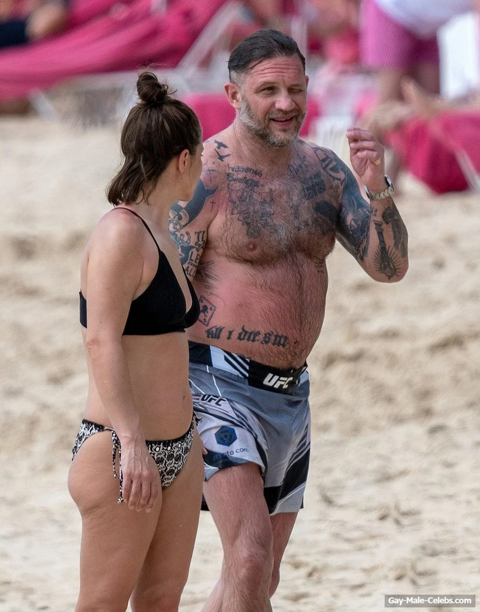Tom Hardy shirtless on a beach