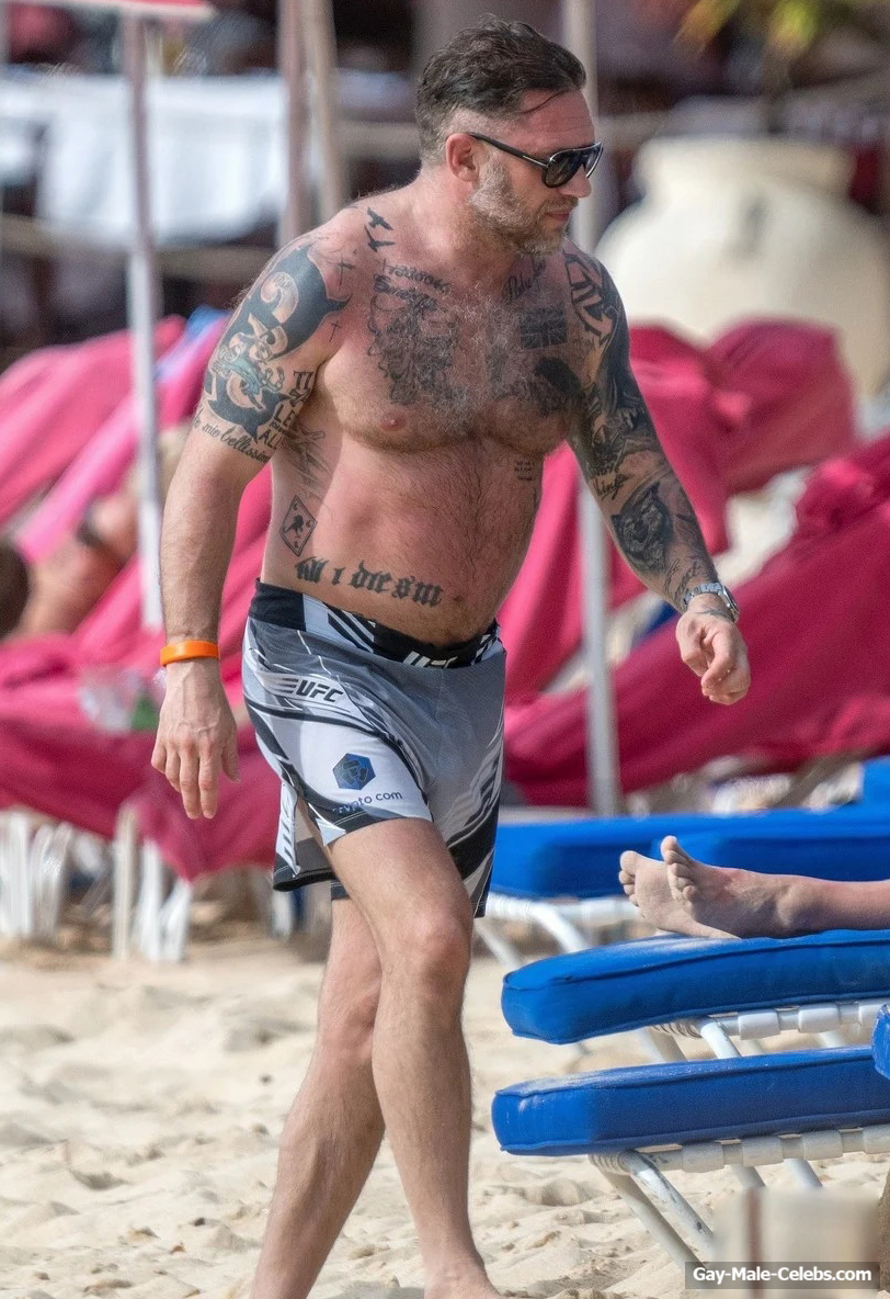 Tom Hardy shirtless on a beach