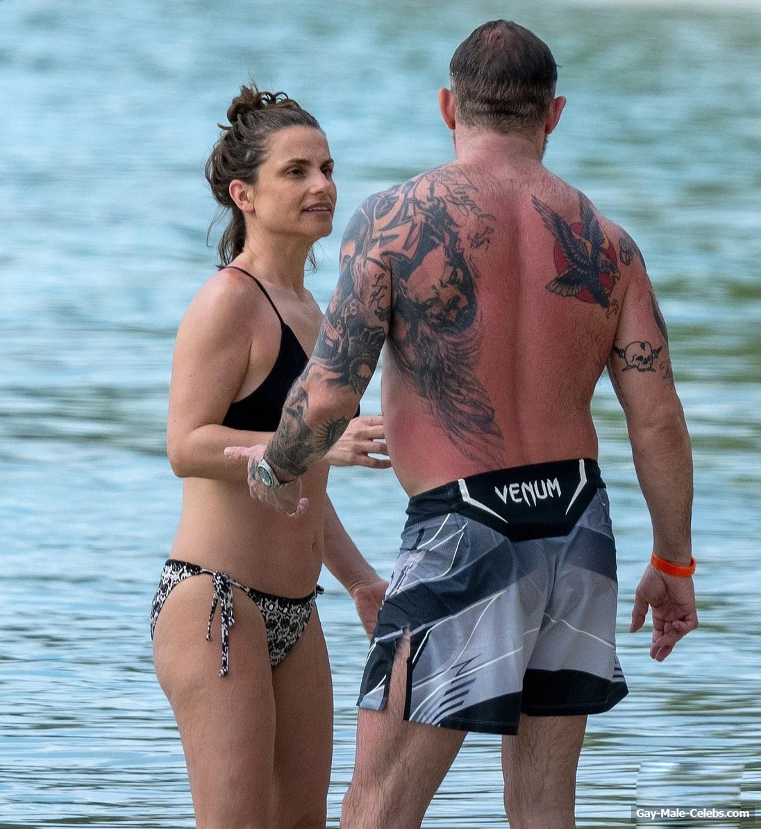 Tom Hardy shirtless on a beach