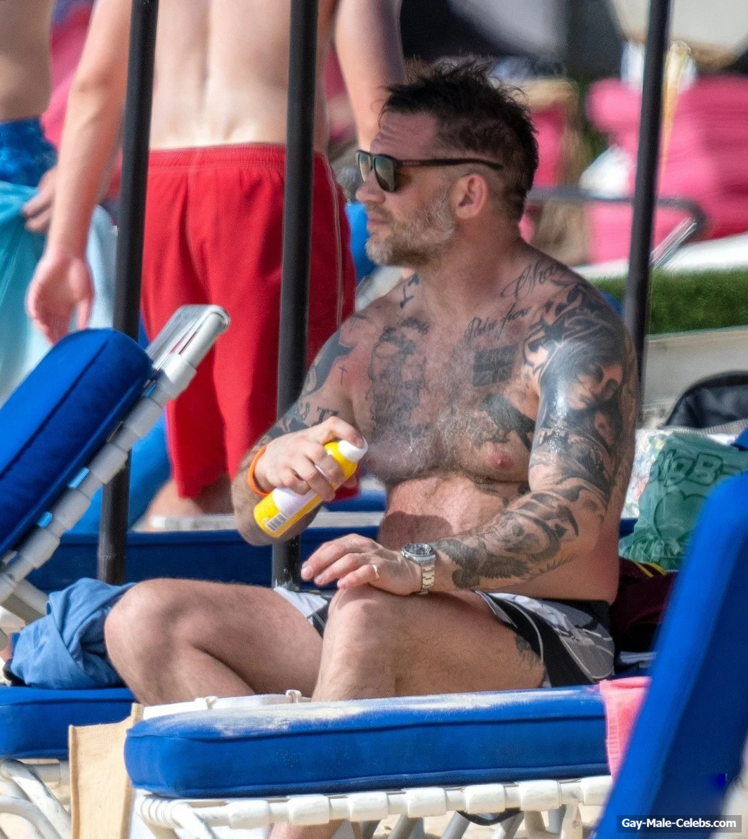 Tom Hardy shirtless on a beach