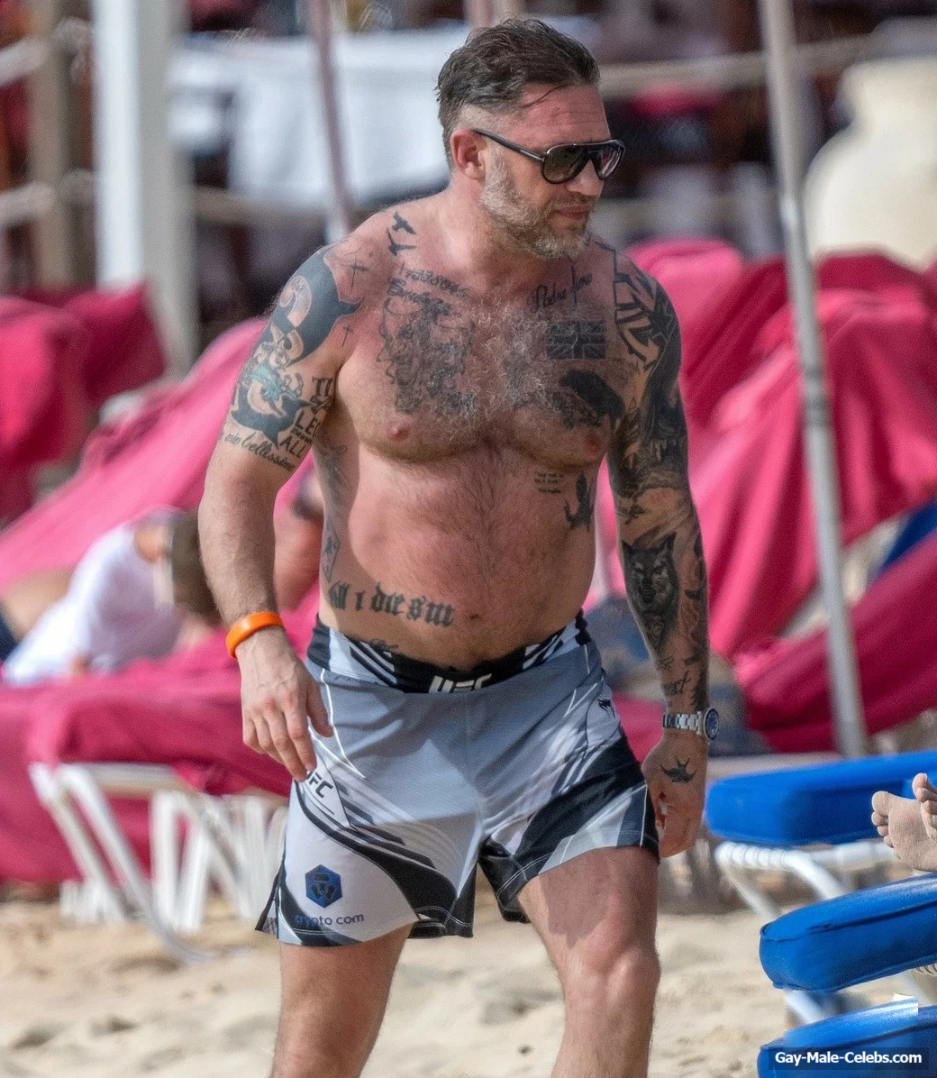 Tom Hardy shirtless on a beach