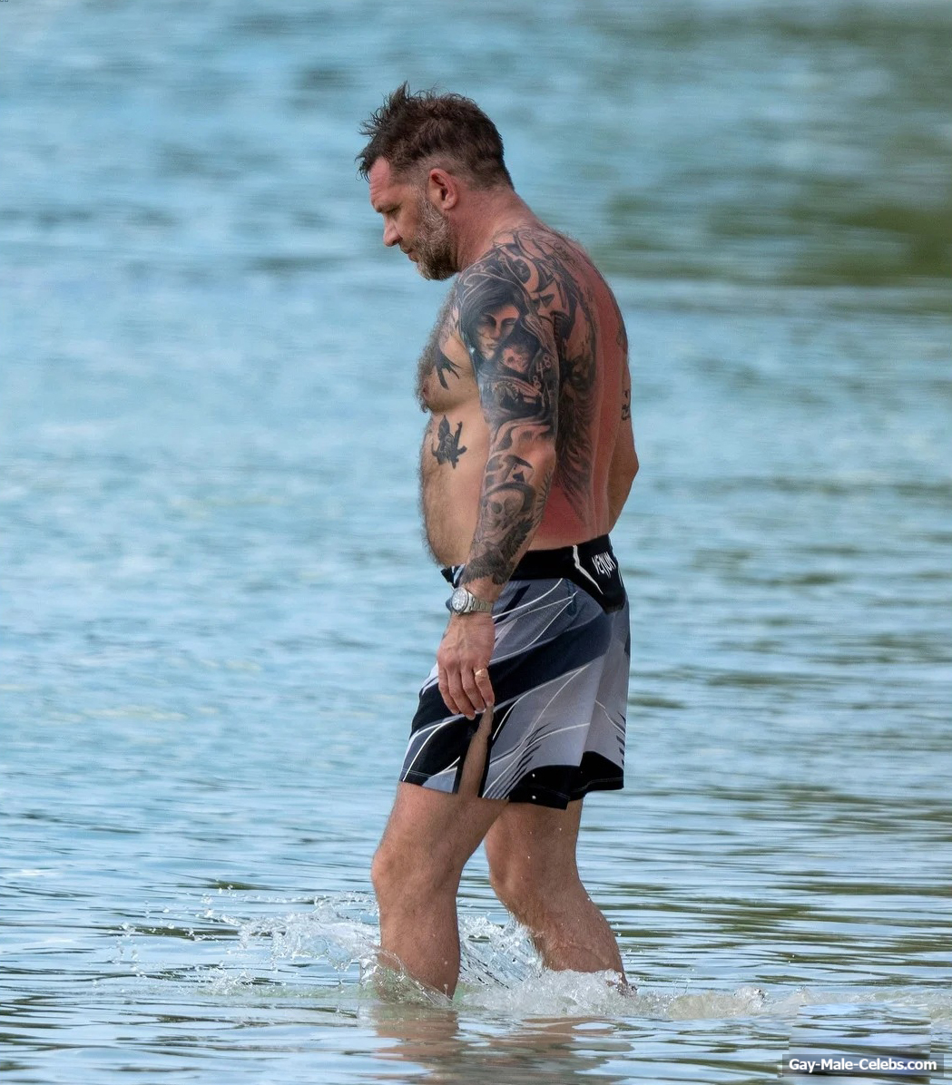 Tom Hardy shirtless on a beach