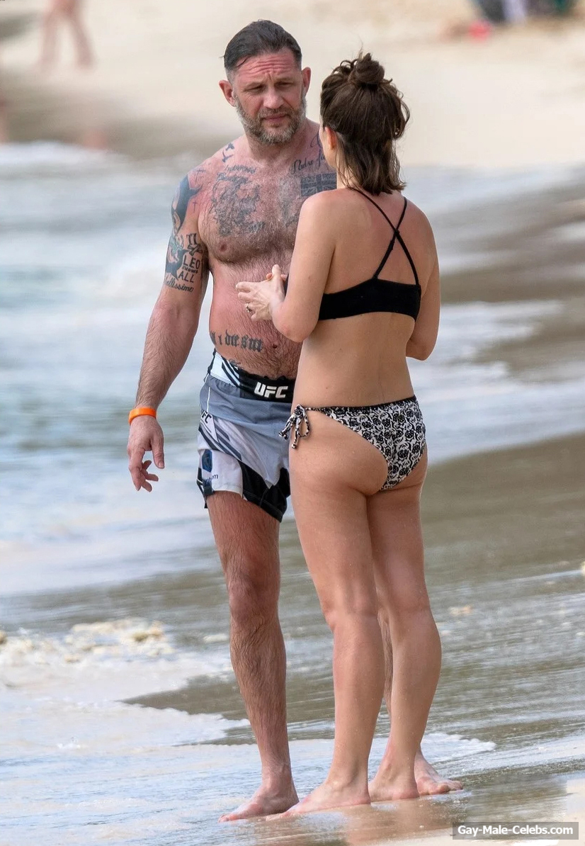 Tom Hardy shirtless on a beach