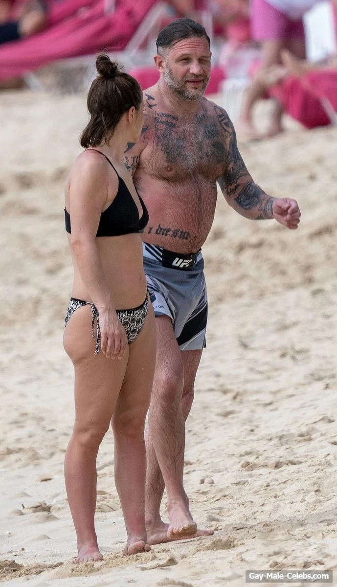 Tom Hardy shirtless on a beach