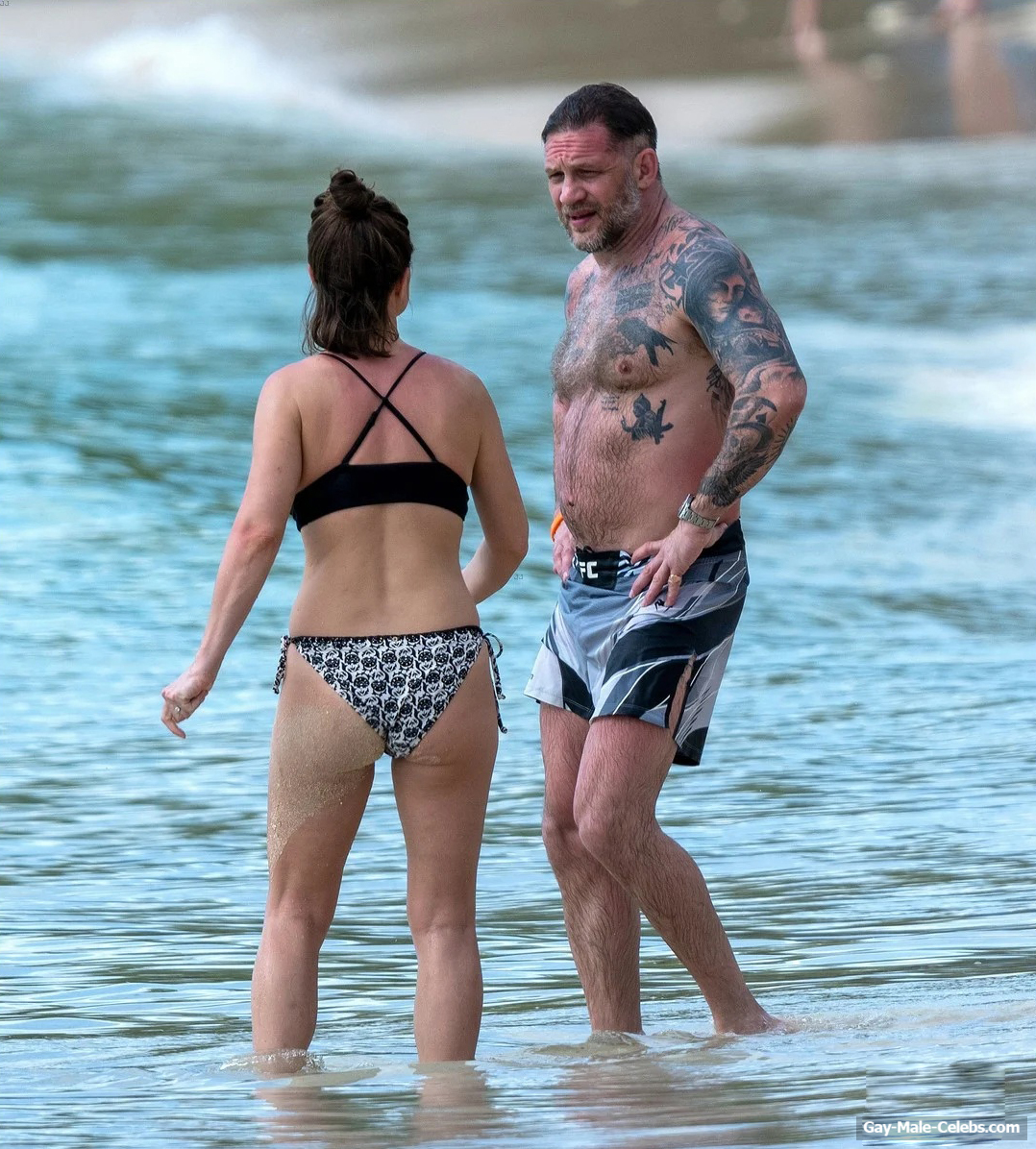 Tom Hardy shirtless on a beach