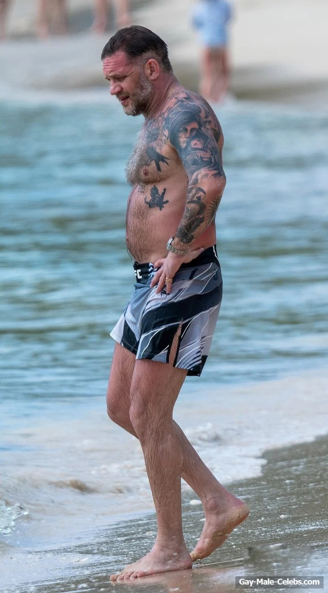 Tom Hardy shirtless on a beach