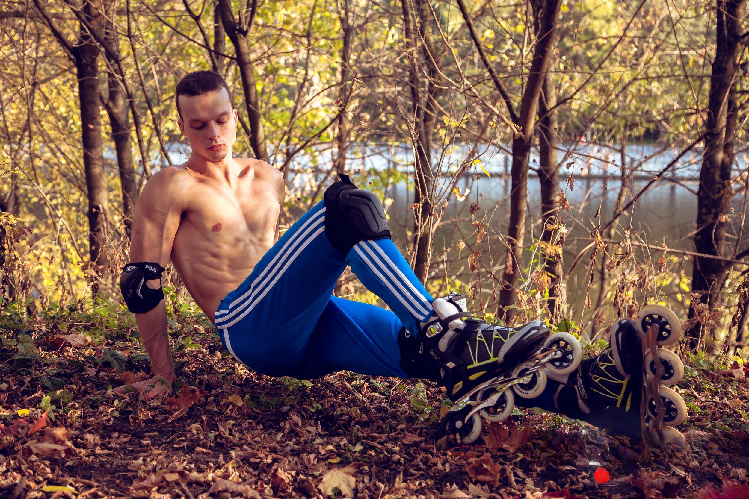 Man on Rollerblades Posing Nude