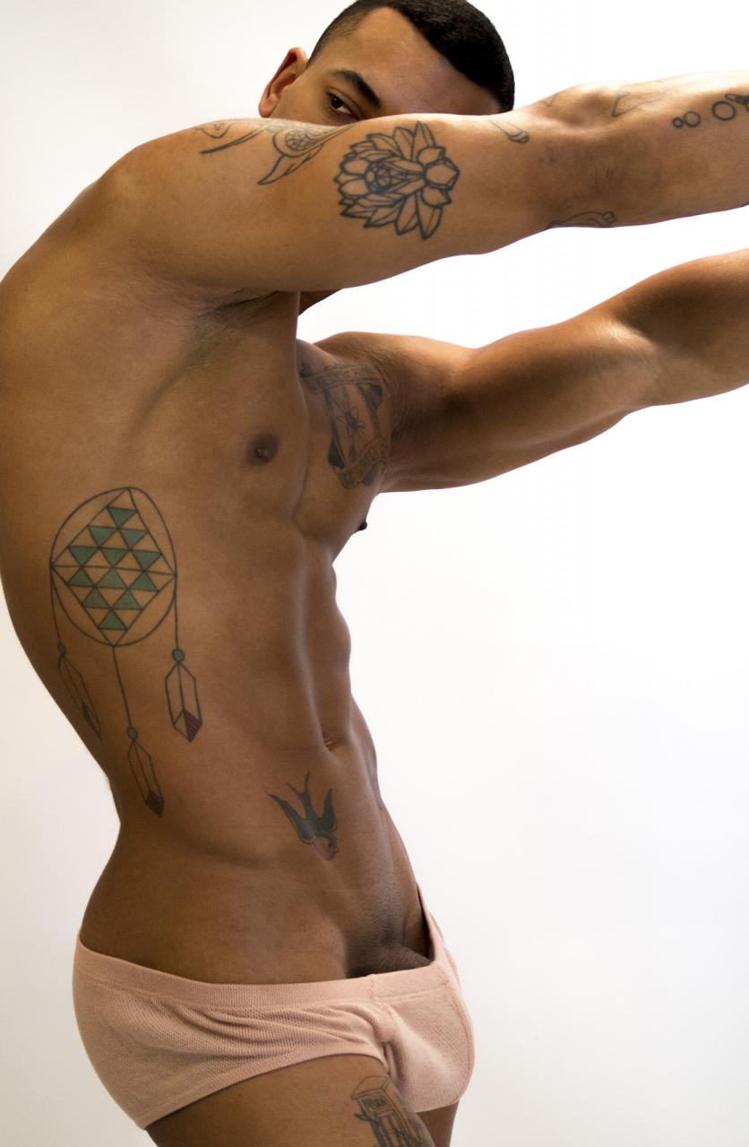 Mickey, a handsome black shows off his “BBC”