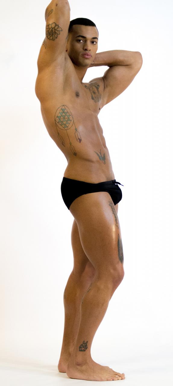 Mickey, a handsome black shows off his “BBC”