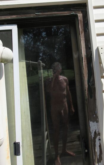 My first self-nudes at NDN, taking category name Artistic Nudes seriously, 5 pics, titled "Reflection with Light-&-Shadows" show my OUTDOOR reflection in my backyard deck’s door-glass. Slight double image due to double-pane glass. Light/dark was NOT tweak