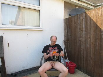 Chris showing off his cock on his balcony