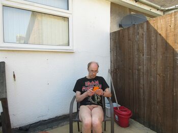 Chris showing off his cock on his balcony